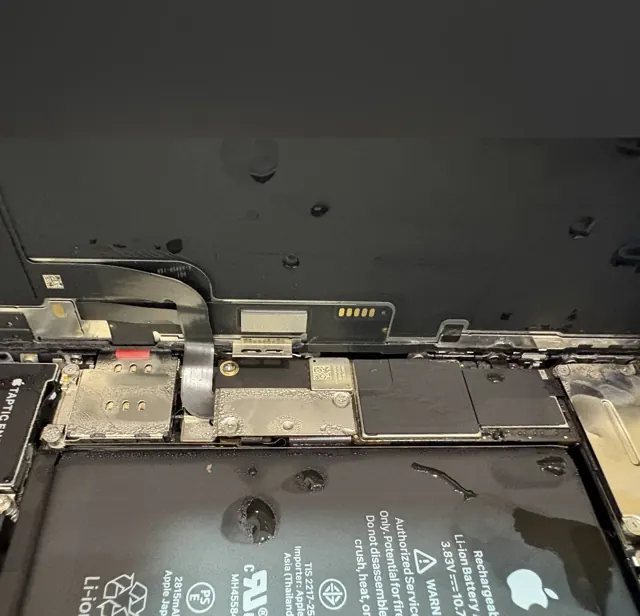 Water droplets inside an iPhone, found while treating water damage